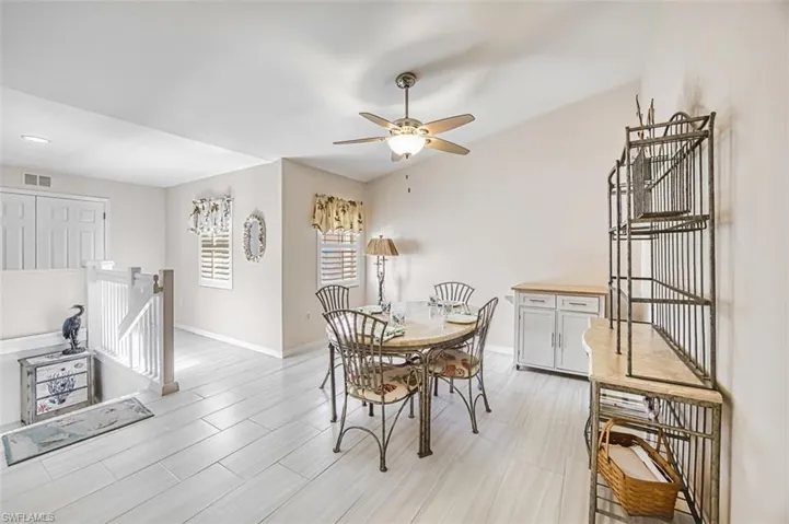 Dining room featuring a ceiling fan and wood finish floors