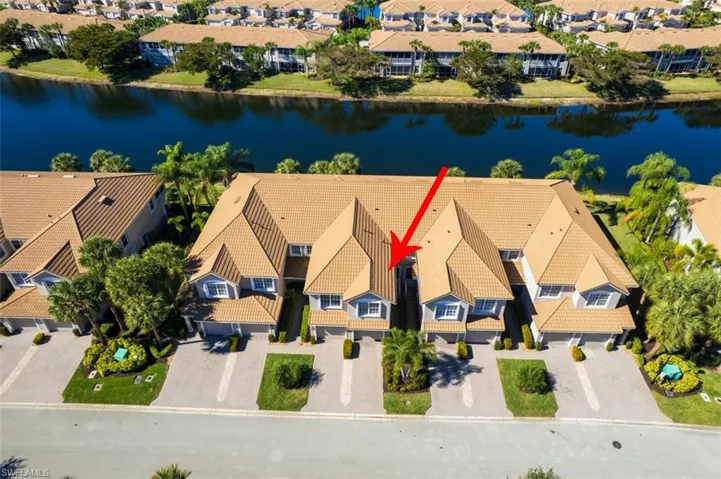 Aerial perspective of suburban area with a large body of water