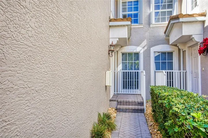 Property entrance with stucco siding