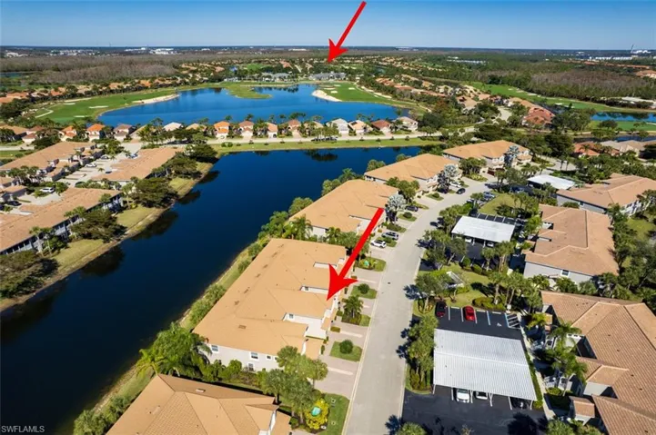 Aerial perspective of suburban area with a nearby body of water