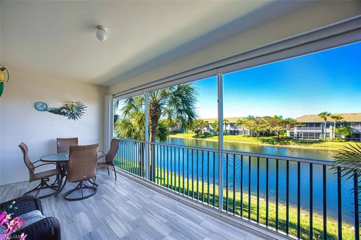 Sunroom with a water view