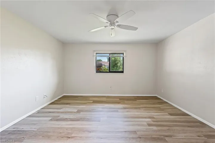Spare room featuring ceiling fan and light hardwood / wood-style floors