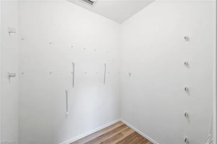 Washroom featuring hardwood / wood-style flooring