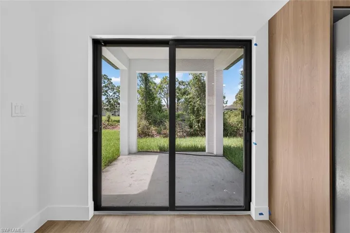 Sliding glass door leading to a covered patio