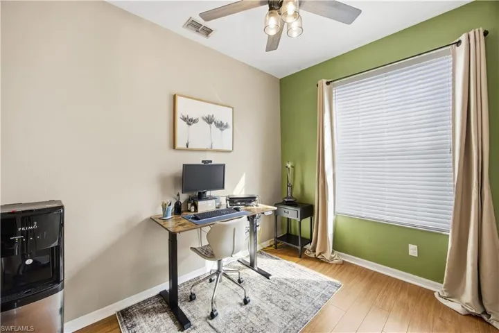 Office space featuring light wood finished floors and ceiling fan