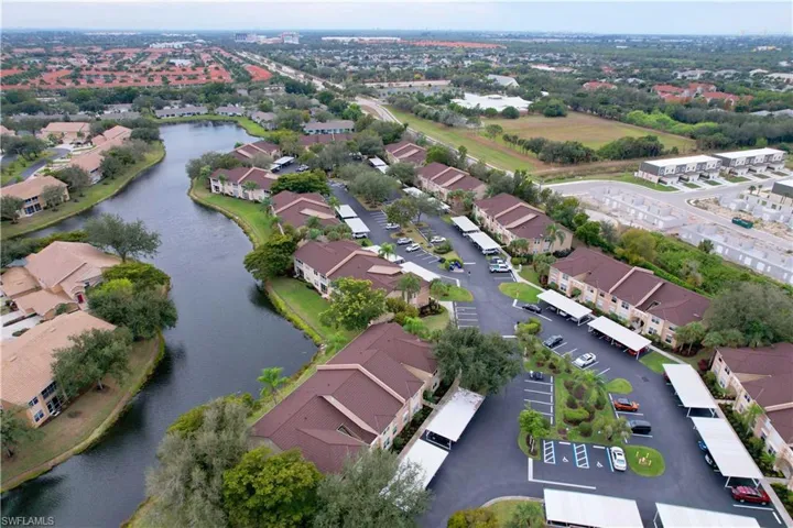 Aerial view of property's location with a nearby body of water