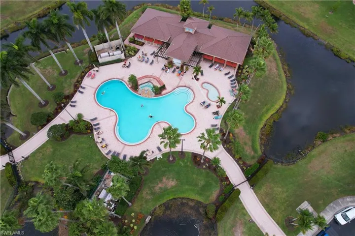 Aerial view of property's location with a large body of water