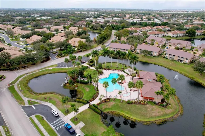 View of property location featuring a large body of water and a pool area