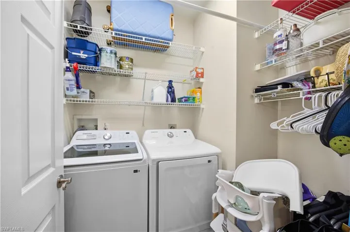 Laundry area featuring separate washer and dryer