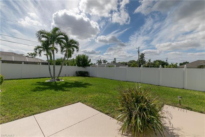 Large backyard with vinyl fence