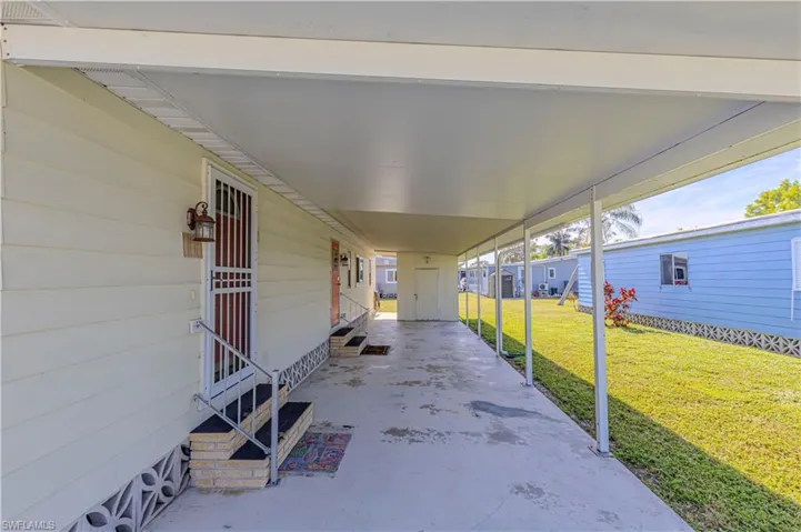 View of patio / terrace featuring a carport