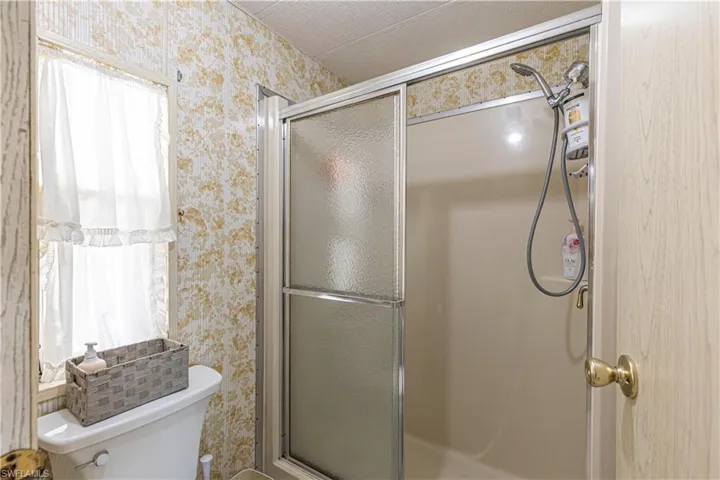 Bathroom featuring toilet and walk in shower