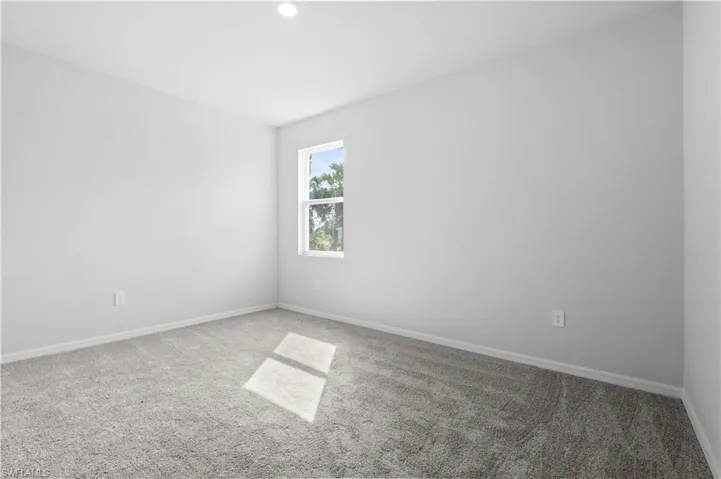 Spare room with carpet floors and recessed lighting