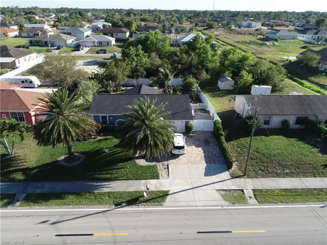 Birds eye view of property with a residential view