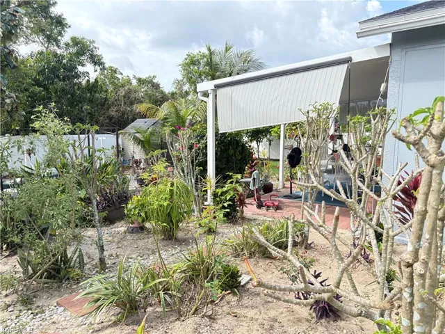 View of yard with a patio and fence
