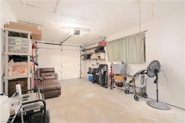 Garage featuring a garage door opener
