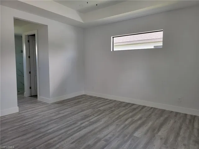 Unfurnished room featuring light wood-type flooring