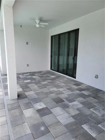 View of patio with ceiling fan