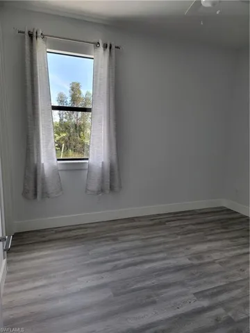 Spare room featuring hardwood / wood-style flooring