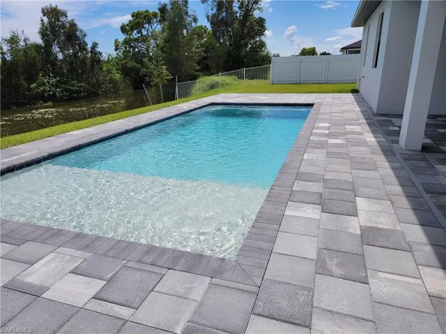 View of swimming pool with a patio