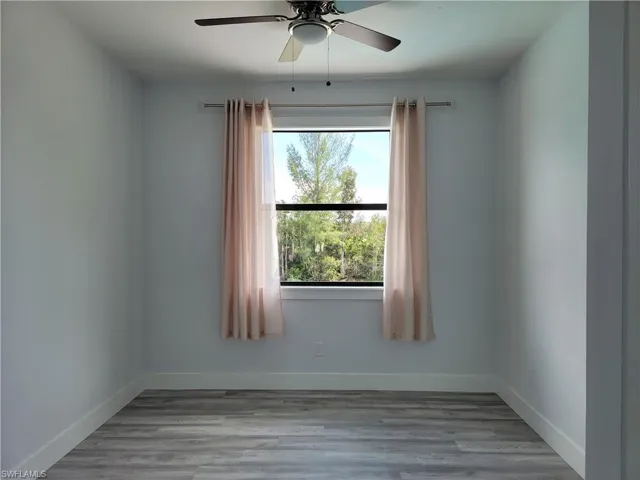 Spare room featuring light hardwood / wood-style flooring and ceiling fan