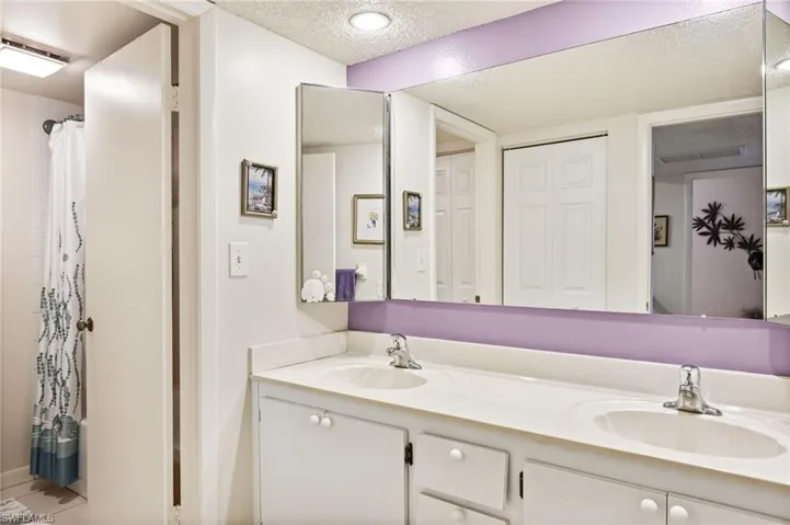 Guest bathroom - with a double-vanity and a door to separate vanity area from shower and toilet room.