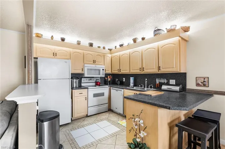 Kitchen overlooking dining area and living room.