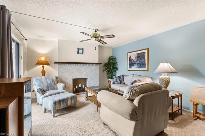 Family room with faux fireplace.