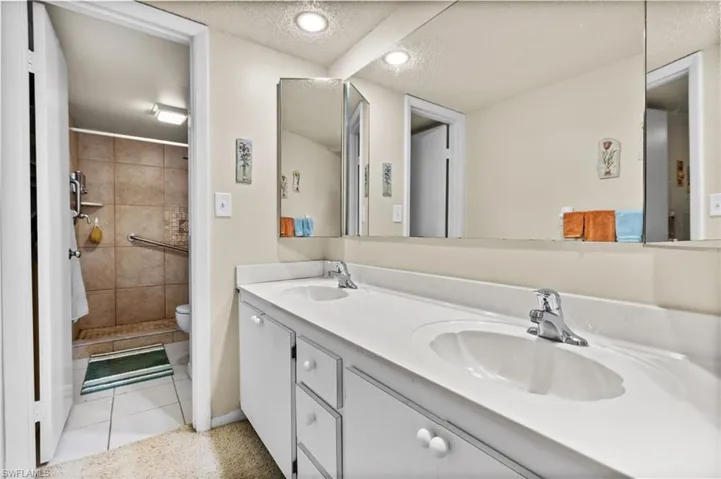 Primary bathroom has a double-vanity.