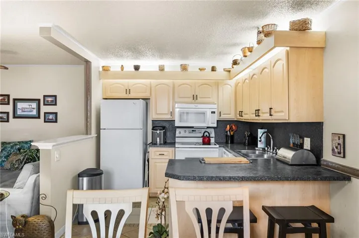 Kitchen overlooking dining area and living room.