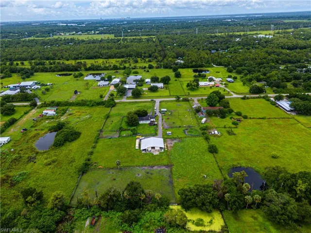 Overview of rural landscape with a nearby body of water