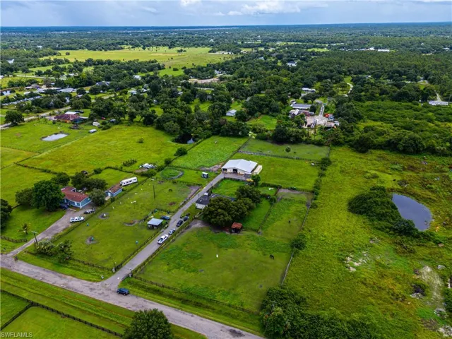 Aerial view of property and surrounding area featuring rural landscape