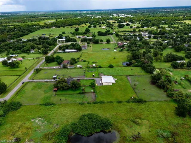 Aerial view of property's location featuring rural landscape and agricultural land