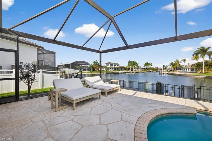 Sunning deck, heated pool, serene water views, picture window screens