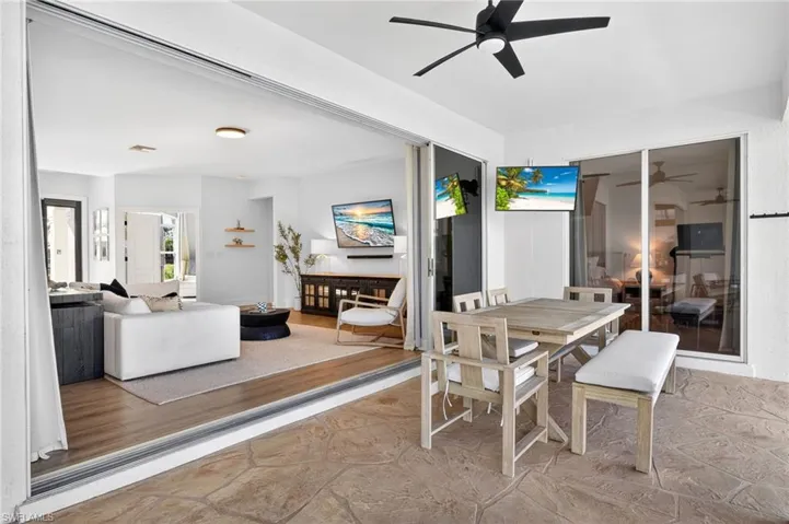 Outdoor patio dining area, sliders fully open for seamless indoor/outdoor living
