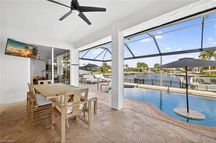 Outdoor pool with a covered lanai, heated pool and a wide water views