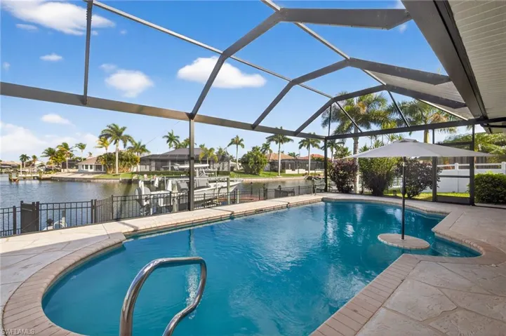 Heated enclosed pool, picture window screens, gulf access, boat lift & dock, bran new pool pump (2026)