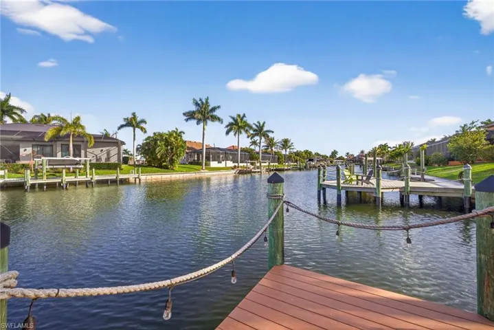 Dock area with lighting and a water views, gulf access