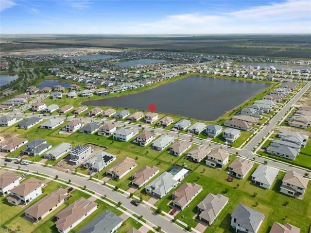 Bird's eye view with a water view and a residential view