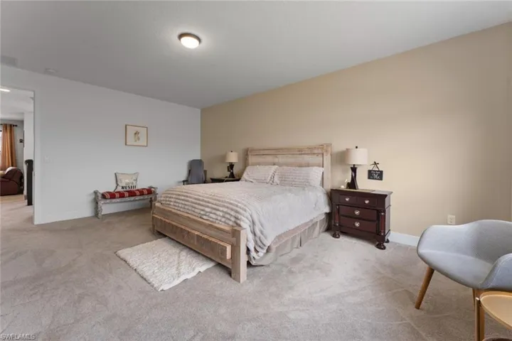 Bedroom featuring carpet, visible vents, and baseboards
