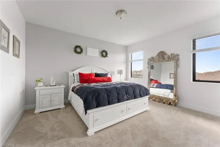 Carpeted bedroom with baseboards