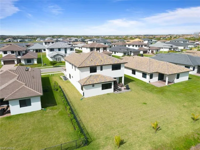 Birds eye view of property with a residential view