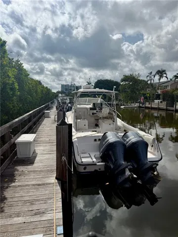Dock area featuring boat slip C-10