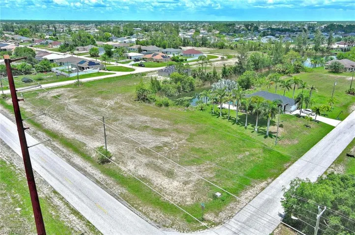 Aerial perspective of suburban area with a nearby body of water