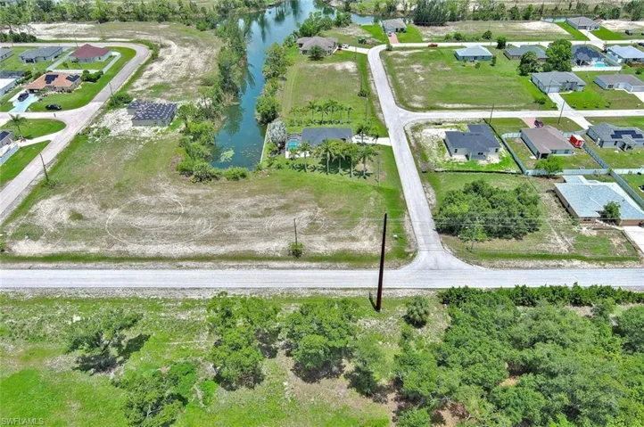View of property location featuring nearby suburban area and a large body of water
