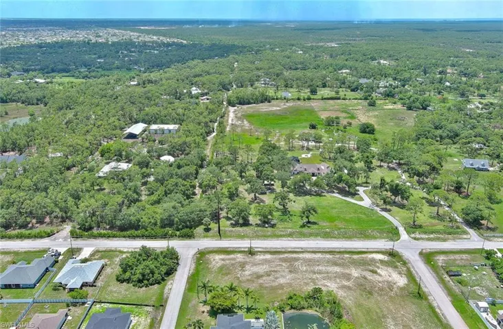 View of property location featuring a forest
