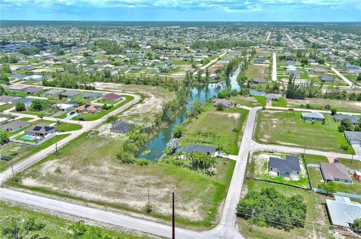 View of property location with nearby suburban area and a large body of water