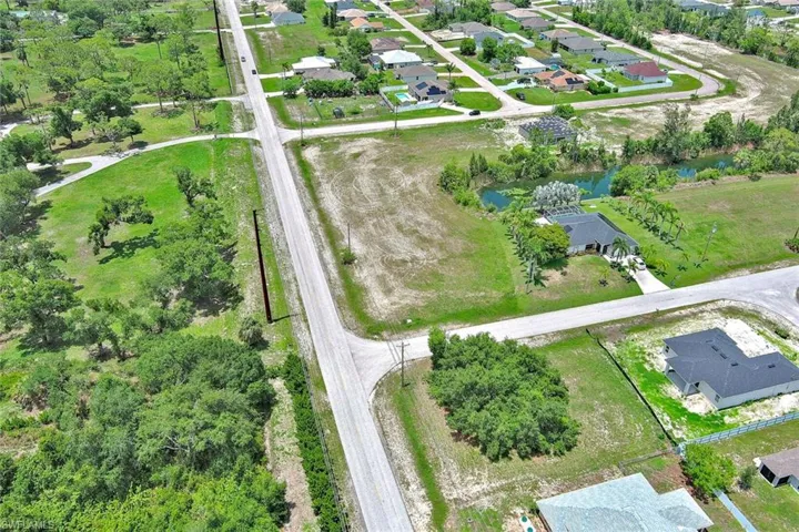 View of property location featuring nearby suburban area and a large body of water