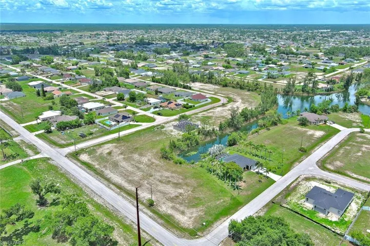 View of property location with nearby suburban area and a nearby body of water