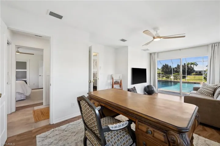 Bedroom 4, currently used as an office, and open to the pool